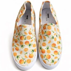 Orange and white canvas slip-on‎ shoes with a comfortable fit